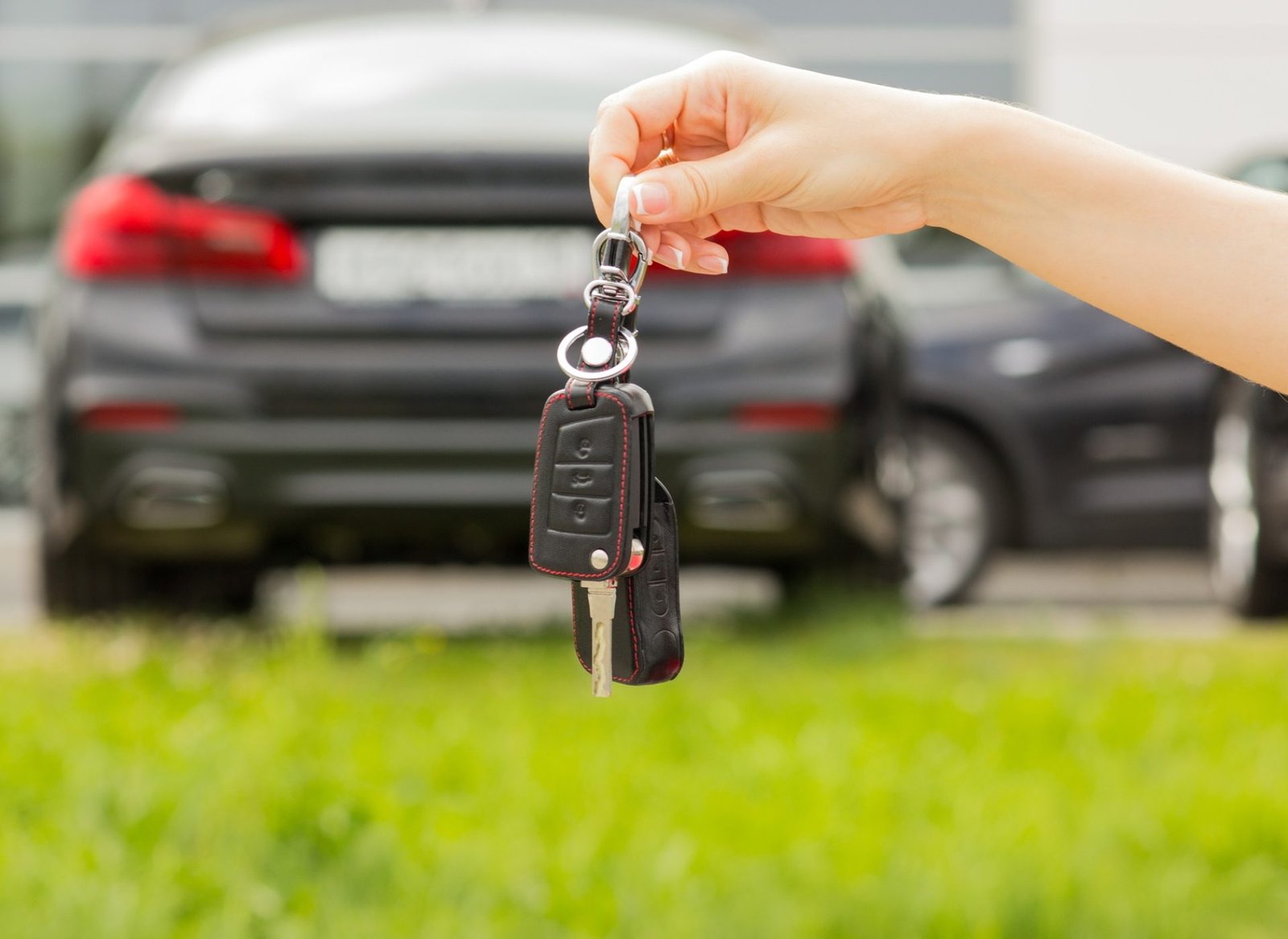 Hand of a woman with a car key Hand of a woman with a car key